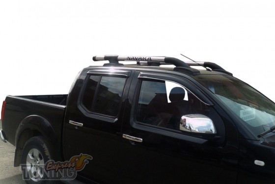 Оригинальные дуги на крышу Nissan Navara D40 фото